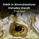 Siddh in Rinmukteshwar Mahadev Mandir with gold idol and Shiva trident .