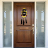 Wooden front door with decorative mask hanging on a house exterior