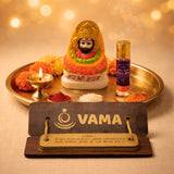 Decorative item with colorful statue, lit candle, and 'VAMA' brand.