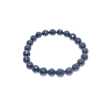 Navy blue beaded bracelet on a white background