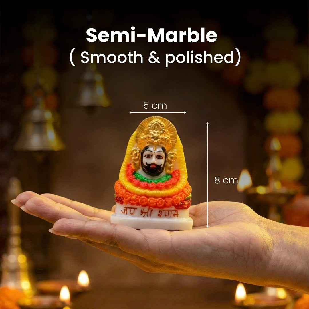Small semi-marble statue held in a hand with measurements, blurred background