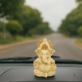 Vighnaharta Ganesh Idol in Ivory colour in car Dashboard.