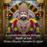 Miniature temple figure with intricate jewelry and floral decorations.