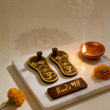 Decorative items including sandals, a candle, and marigold flowers.