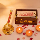Decorative setup with a golden lamp, candles, and a wooden board.