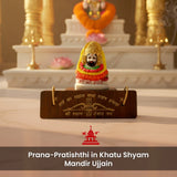 Small idol on a stand with religious significance in a temple setting