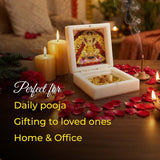 Decorative item with candles and rose petals on a table, suitable for daily pooja and gifting.