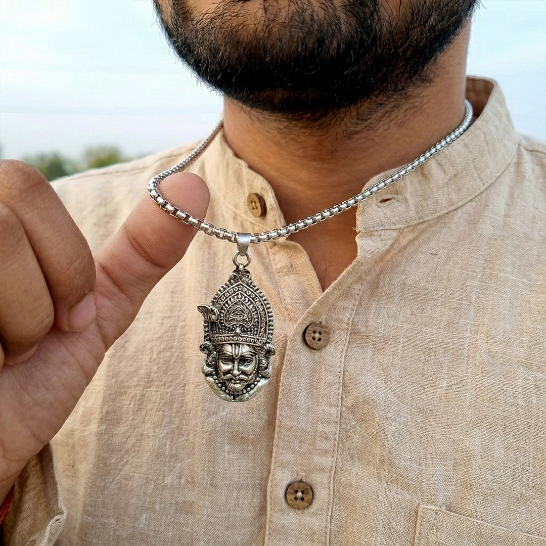 Man wearing Khatu Shyam Silver Pendant with featuring a detailed pendant.