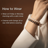 Bracelets on a wrist with text on how to wear them against a brown background